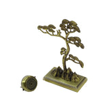 Bronze tree-shaped incense burner on a white background