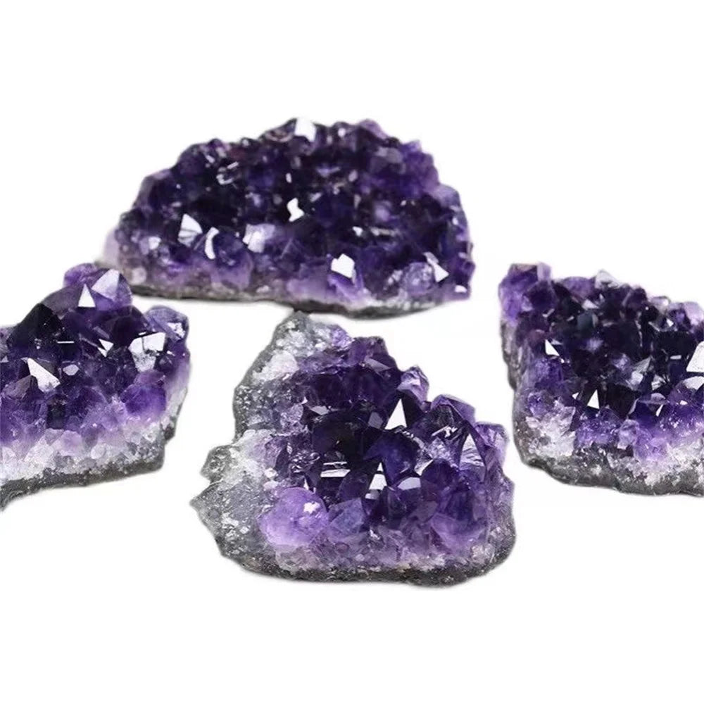 Amethyst crystal clusters on a white background