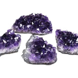 Amethyst crystal clusters on a white background