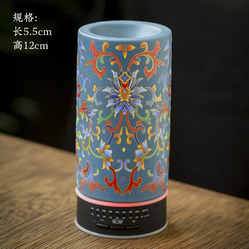 Decorative cylindrical lamp with colorful patterns on a wooden surface
