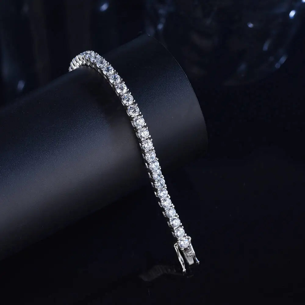 Silver bracelet with clear stones on a dark background