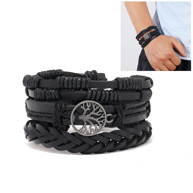 Black braided bracelet with tree of life charm on a white background