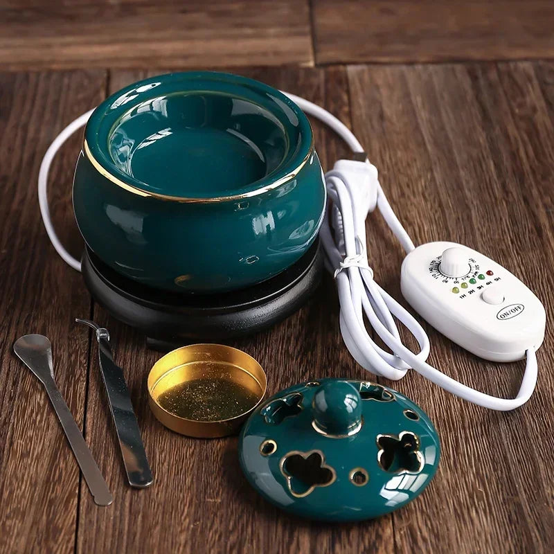 Teal ceramic warmer with control unit on a wooden surface