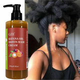 Bottle of GZE Batana Oil Biotin Hair Cream with a woman with styled hair.