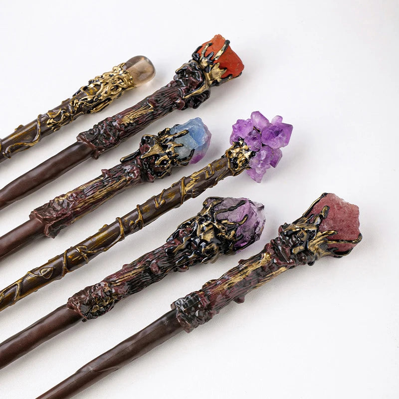 Set of decorative wands with gemstones on a white background