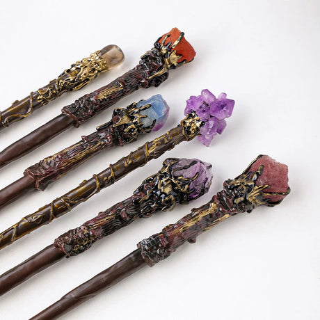 Set of decorative wands with gemstones on a white background
