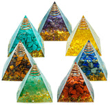 Set of five pyramid-shaped crystal orgone energy generators with colorful stones inside on a white background.