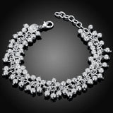 Silver beaded bracelet on a black background