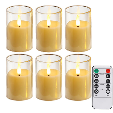 Set of six lit candles in glass holders with a remote control on a white background