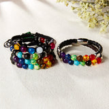 Set of colorful beaded bracelets on a light background