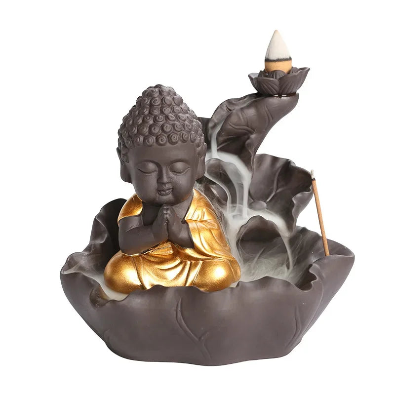 Buddha-shaped incense burner with smoke on a white background