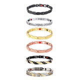 Set of five metallic bracelets in various colors on a white background