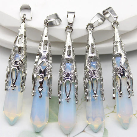 Five silver and opaline glass pendants on a white background