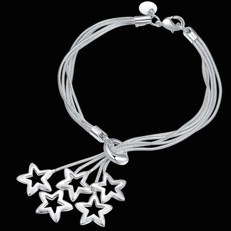 Silver bracelet with star charms on a black background