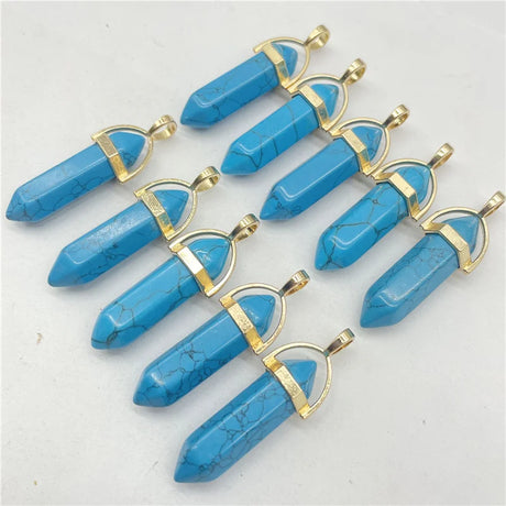 Blue stone pendants with gold accents on a white background