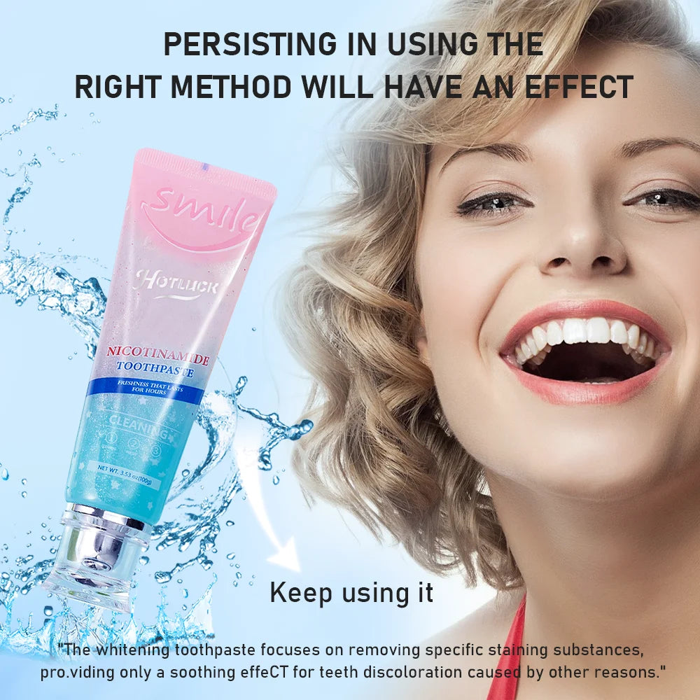 Woman with a bright smile next to a toothpaste tube with water splashes on a light blue background.