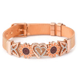 Rose gold dog collar with sunflower and heart designs on a white background