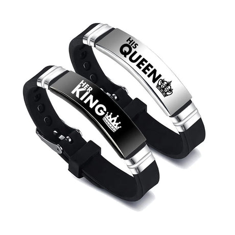Pair of black and silver bracelets with 'His Queen' and 'Her King' text on a white background