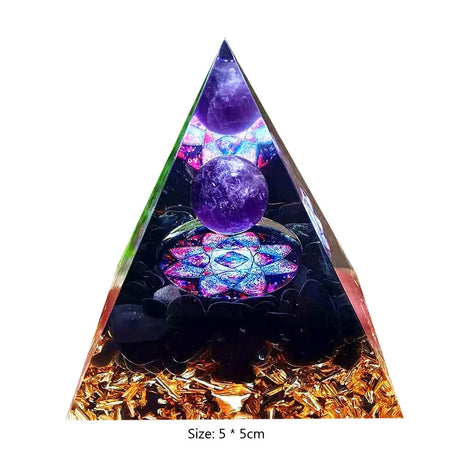 Triangular crystal orgone pyramid with purple spheres and colorful interior on a white background