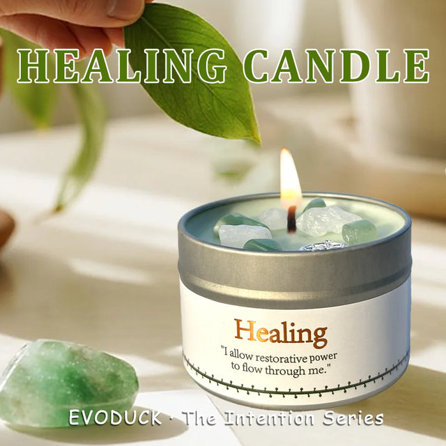 Healing candle with green leaf and crystal on a light background, featuring the brand 'EVODUCK'.