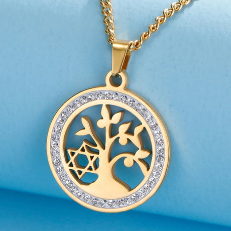 Gold necklace with a tree of life pendant on a blue background