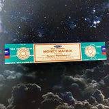Sriyana Money Matrix incense packaging on a dark background