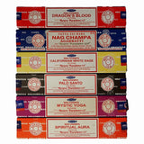 Stack of Nag Champa incense boxes in various colors with different incense names.