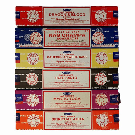 Stack of Nag Champa incense boxes in various colors with different incense names.