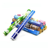 Stack of various rolled-up papers with different colored packaging on a white background