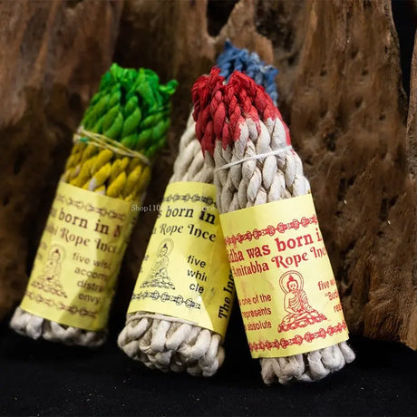 Three bundles of colored rope with labels on a textured background