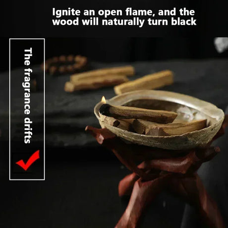 Wooden incense sticks in a holder with text on a dark background