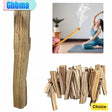 Wooden incense sticks with a match and a blurred background of a person meditating.