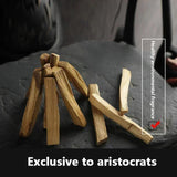 Wooden sticks on a dark surface with text about healthy environment fragrance and exclusivity to aristocrats.