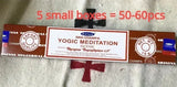 Yogic Meditation incense packaging with text indicating quantity on a textured surface.