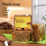 African Black Soap Acne Treatment bar on green leaf with blurred natural background showing handmade quality.