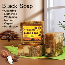 African Black Soap with Organic Shea Butter bars with leaves and nuts showing natural ingredients on neutral background.