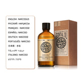 Akarz essential oil bottle and box with language translations on a white background