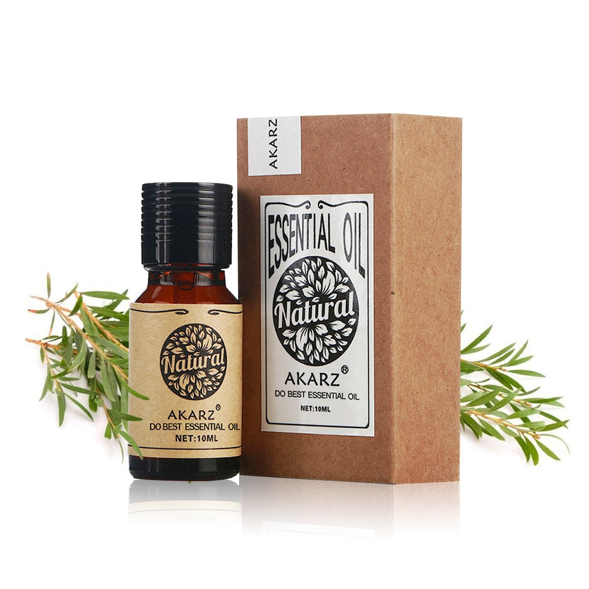 Akarz essential oil bottle and packaging with green leaves on a white background