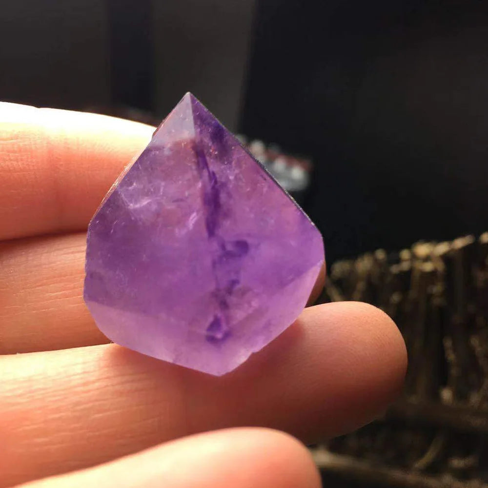 Amethyst gemstone hexagon healing wand for chakra alignment, crystal therapy, and peaceful mindfulness practice.