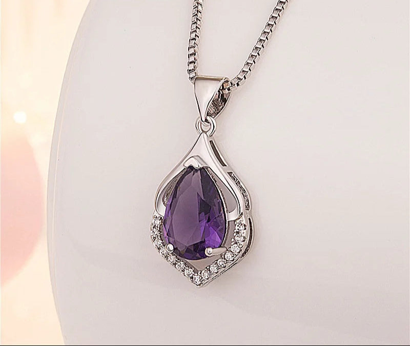 Amethyst gemstone teardrop pendant necklace with faceted pendant for statement accessorizing, evening wear, and gift giving.