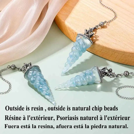 Aquamarine 7-Chakra resin pendulum tool for energy cleansing, chakra work, and meditation practice.