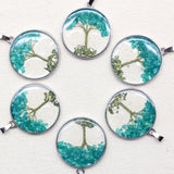 Assorted gemstone Tree of Life pendant set for bracelet making, necklace crafting, and crystal-inspired fashion use.