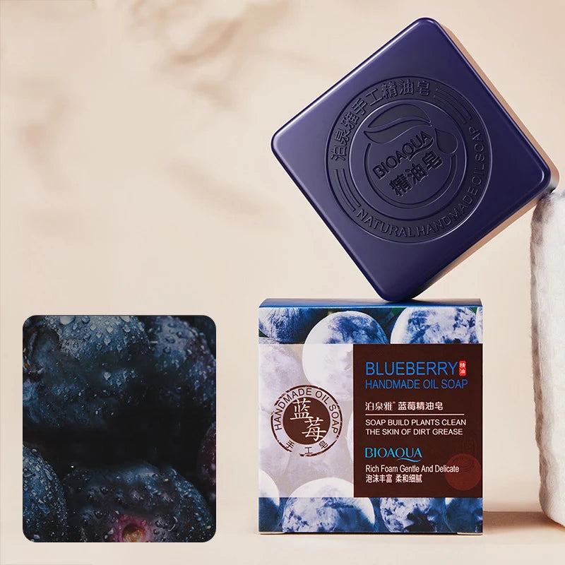 Bamboo Charcoal Blueberry Soap with packaging on beige background for cleansing and brightening.
