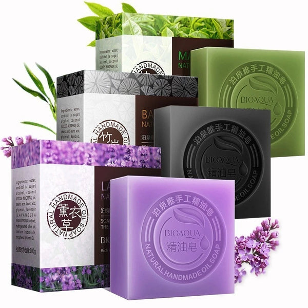 Luxurious Bamboo Charcoal and Essential Oil Soap collection with various bars and packaging on white background.