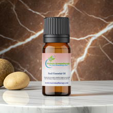 Basil essential oil steam-distilled bottle for aromatherapy, stress relief diffusing, and herbal wellness routines.