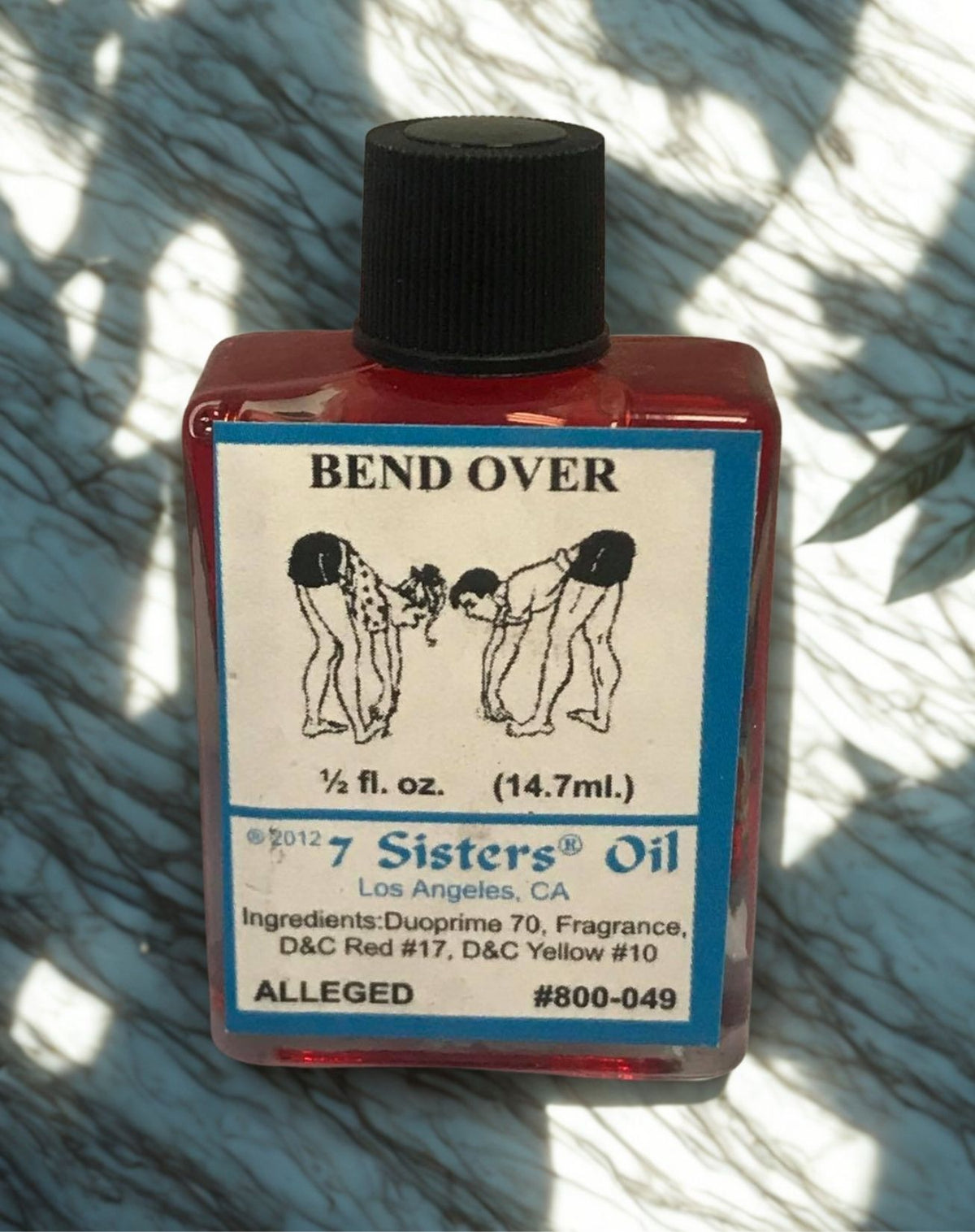 Bend Over Wish Oil ritual oil bottle for candle dressing, intention setting, and spiritual practice.