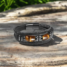 Black leather Tiger Eye bracelet for men with braided band and stone detail for casual outfits, office wear, and everyday accessorizing.