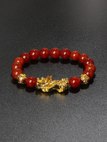 Black Obsidian Feng Shui wealth bracelet with Pi Xiu charm for prosperity, protection, and mindful wear.