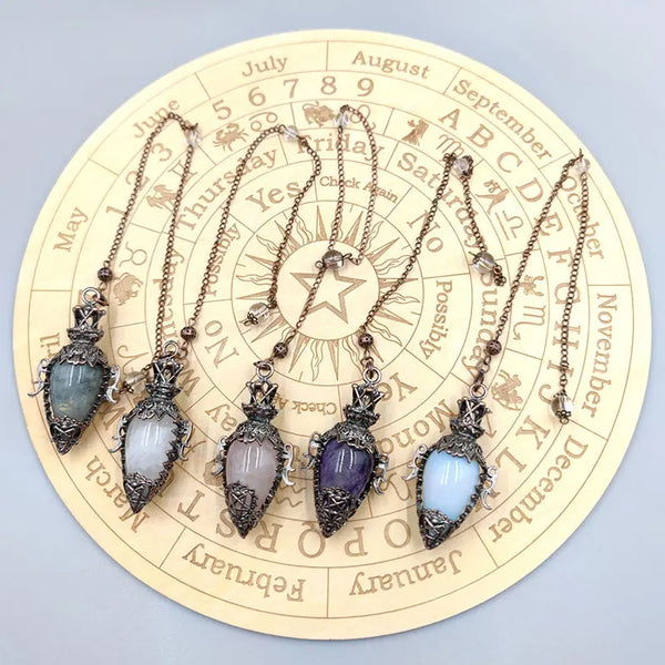 Black Obsidian & Quartz Pendulum for dowsing, divination, and energy work.