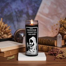 Protection from Evil black prayer candle in glass for warding off evil, spiritual defense, and devotional practice.